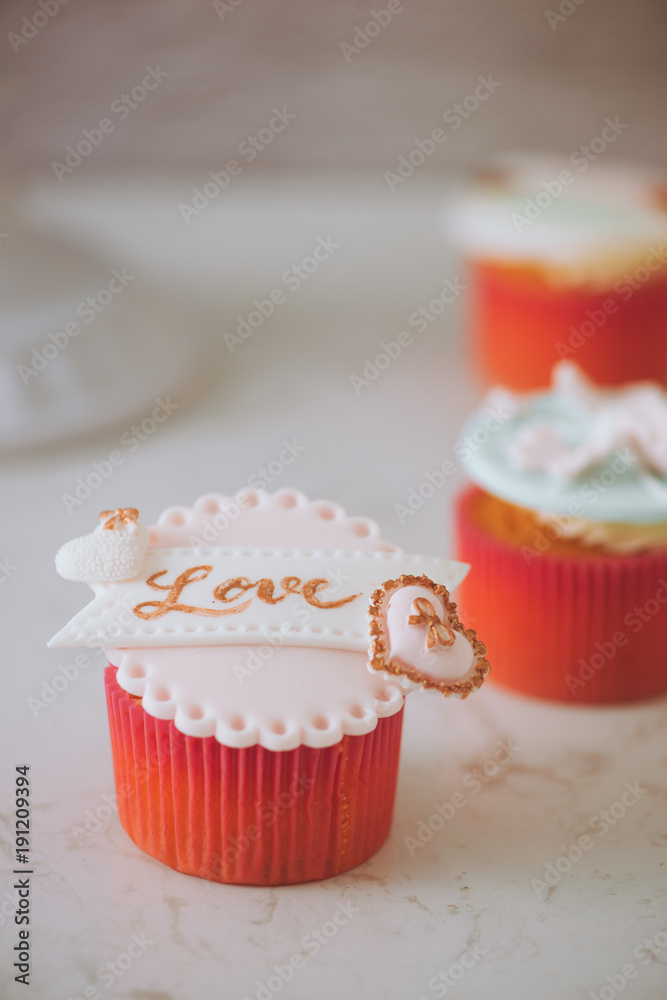 Yummy cupcakes. Valentine sweet love cupcake on table on light background