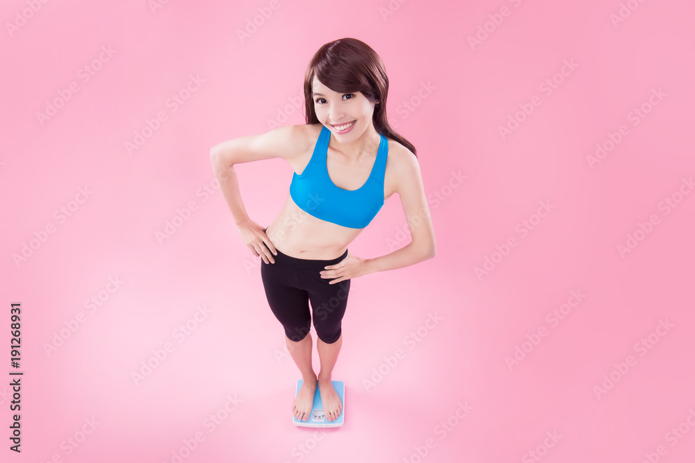 woman stand on weight scale