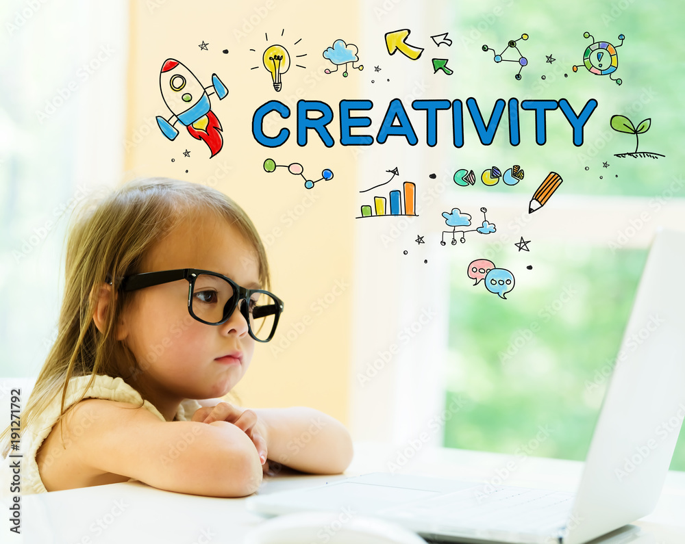 Creativity text with little girl using her laptop