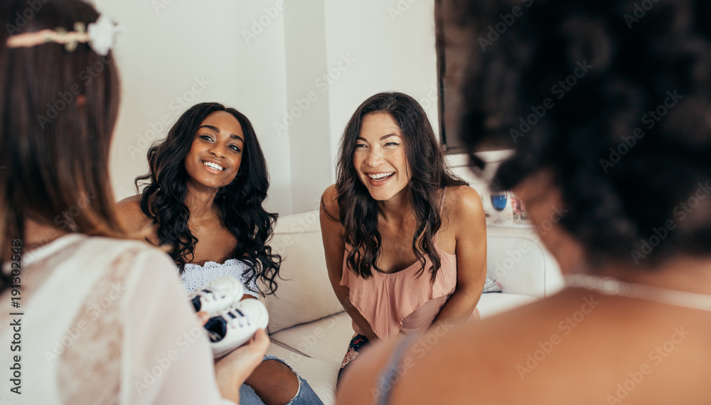 Pregnant woman with best friends at baby shower