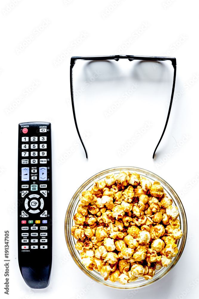 concept of watching movies with popcorn top view white backgroun