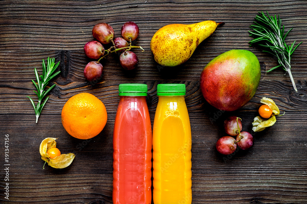 fitness smoothie in plastic bottle on wooden table top view mock