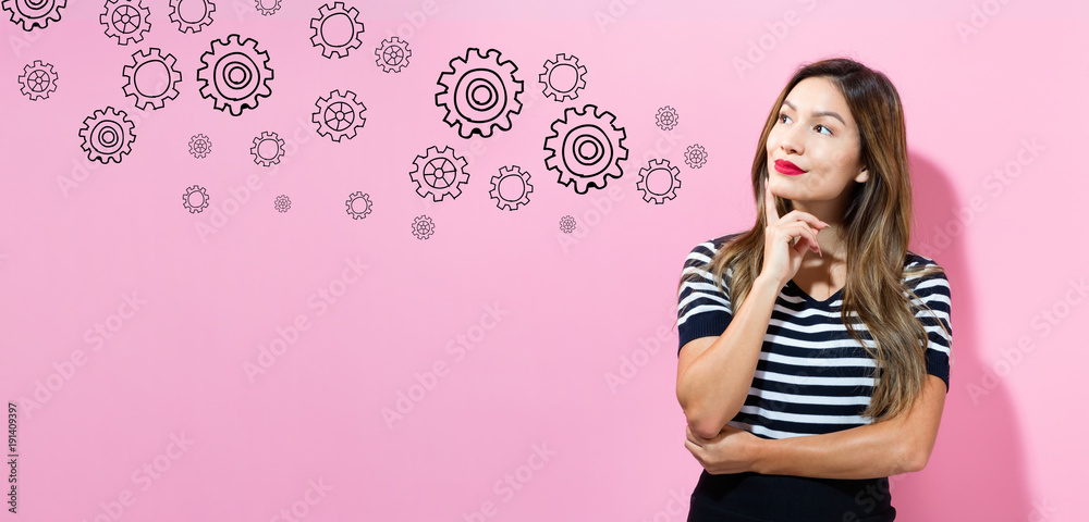 Gears with young woman in a thoughtful pose