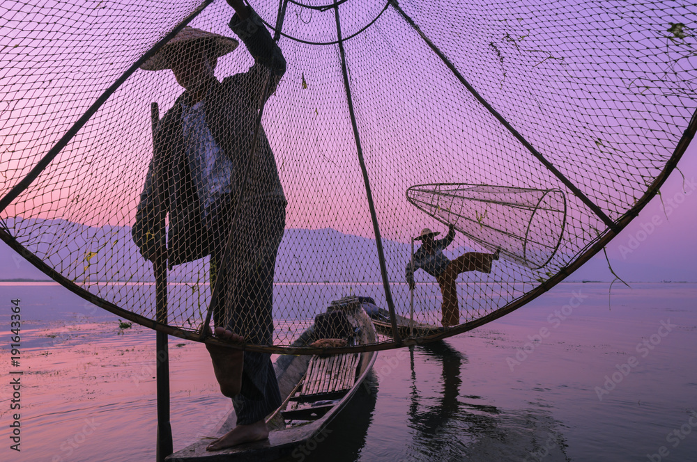 Fisherman on the Inle lake / Fisherman in the morning on Inle Lake, Myanmar, Asia.