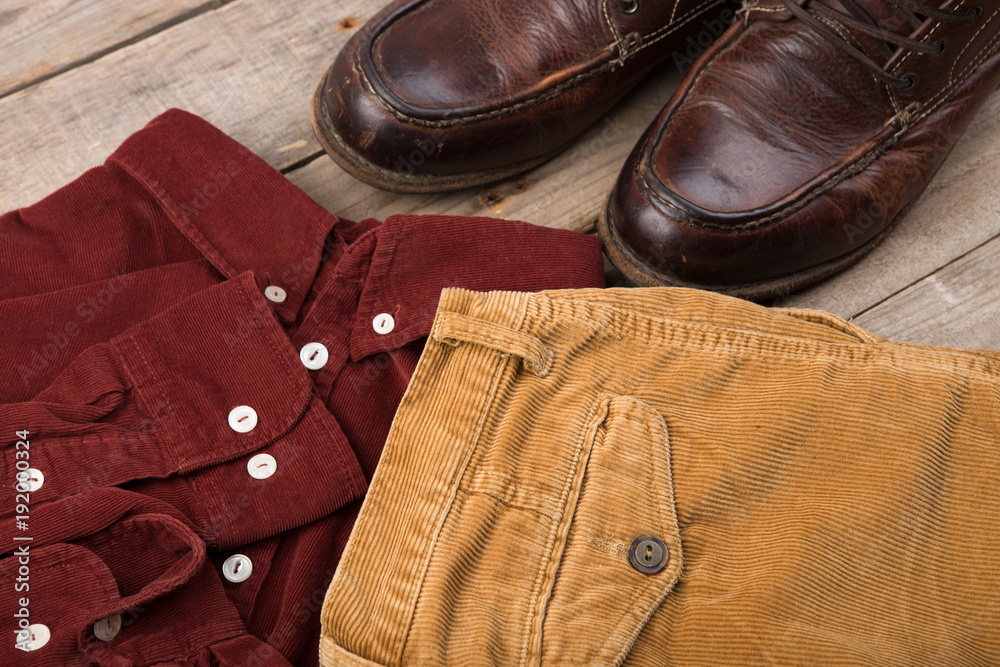 Dark red velveteen shirt on the wooden background