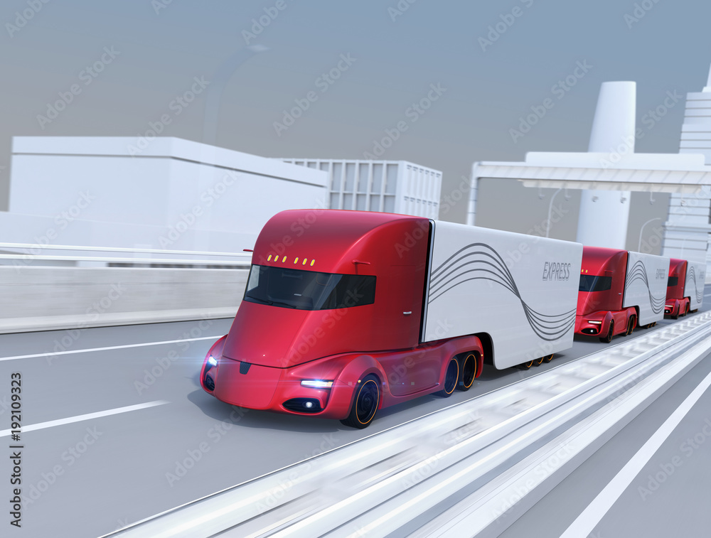 A fleet of self-driving electric semi trucks driving on highway. 3D rendering image.