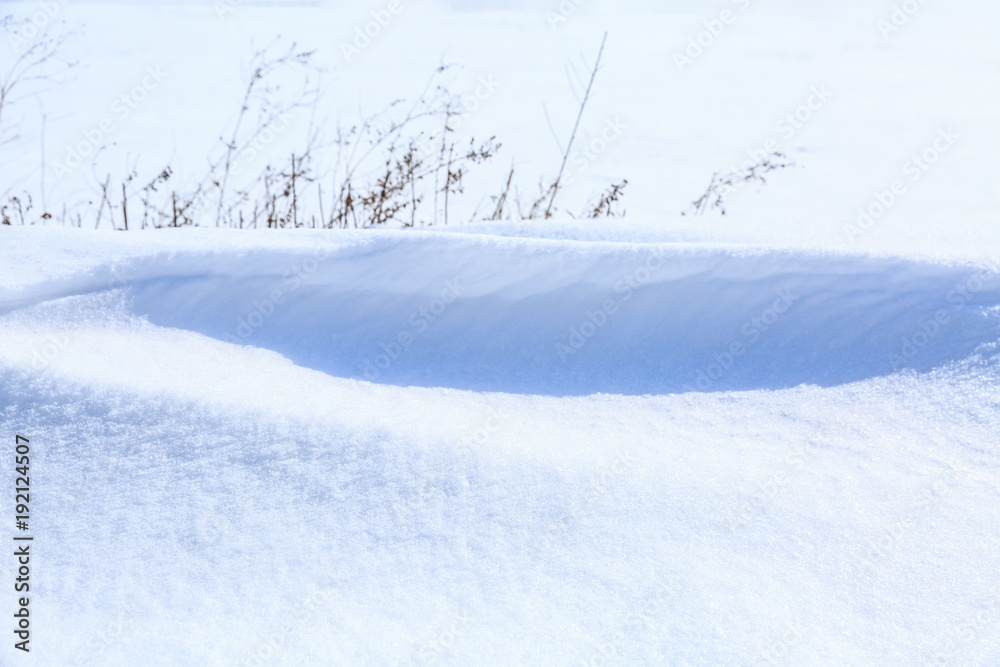 white snow and dry grass scene in winter