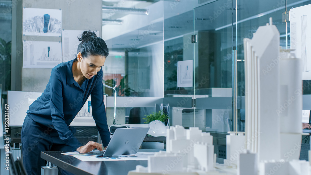 Female Architectural Designer Works on a Laptop,  Engineering New Building Model for the Urban Plann