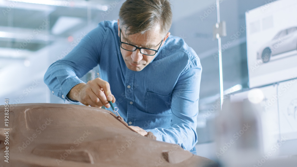 Experience Automotive Designer with a Rake Sculpts Prototype Car Model from Plasticine Clay. He Work