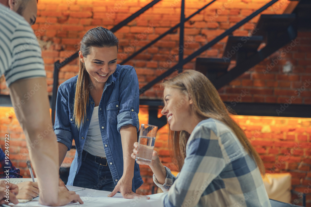 Smiling young people at work