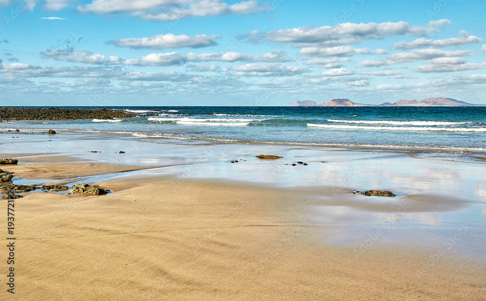 Landscape with volcanic hills and atlantic ocean in Lanzarote