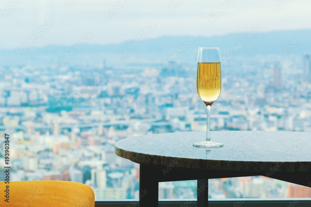 White wine on a table high above the city