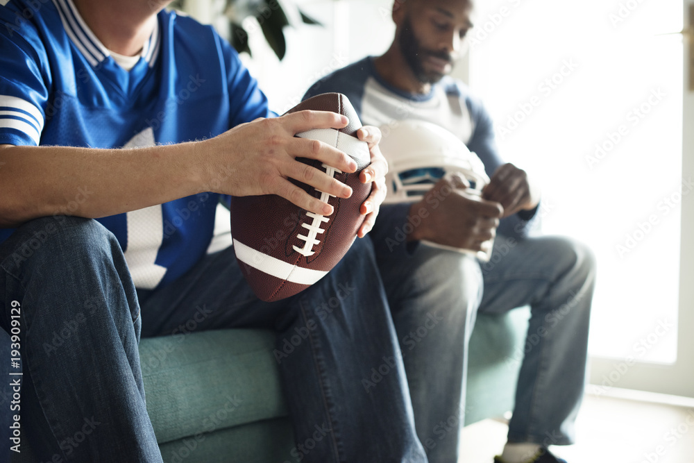 Friends cheering sport league together