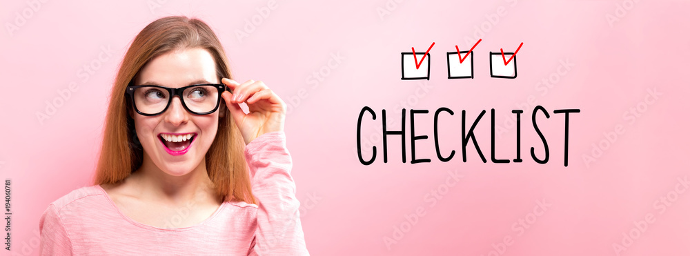 Checklist with happy young woman holding her glasses