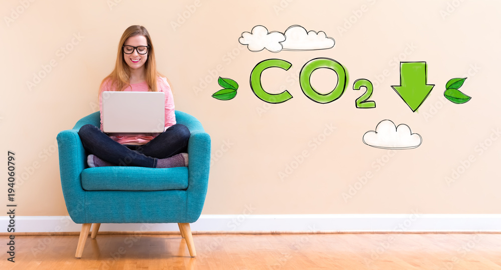 Reduce CO2 with young woman using her laptop in a chair