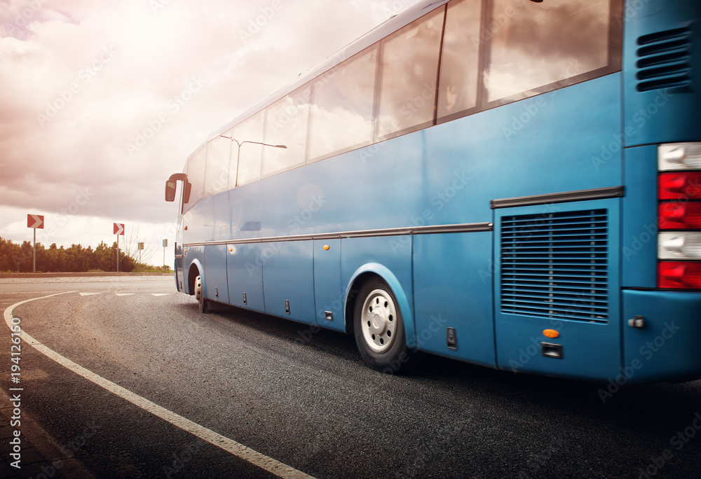 Bus moving on the road in city in early morning. View to the traffic