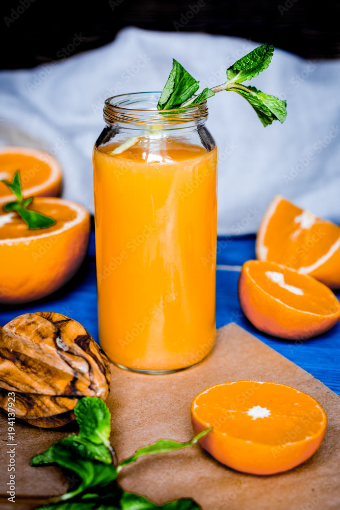 healthy morning with orange juice in bottle on kitchen backgroun