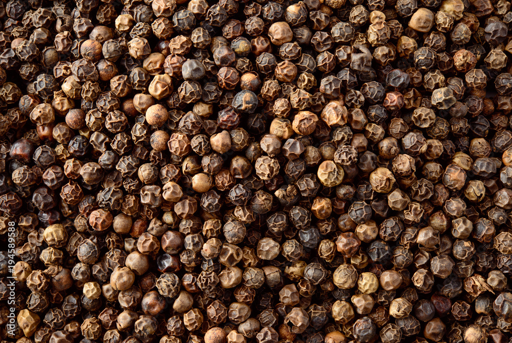 Black Pepper. Peppercorns background, texture. Top view.