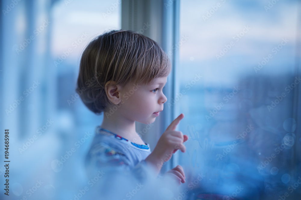 Child looking at window