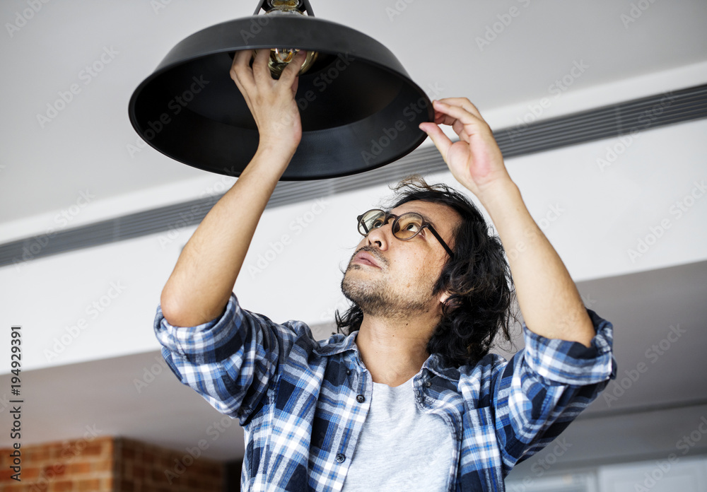 Man changing lightbulb