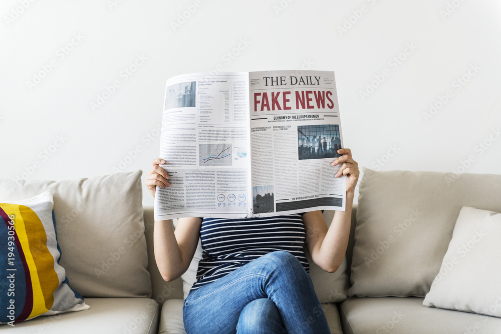 Woman reading newspaper