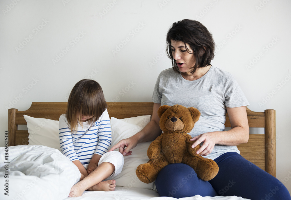 Pregnant mom talking to daughter consolation concept