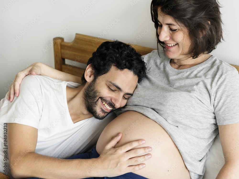 Couple lying in bed together