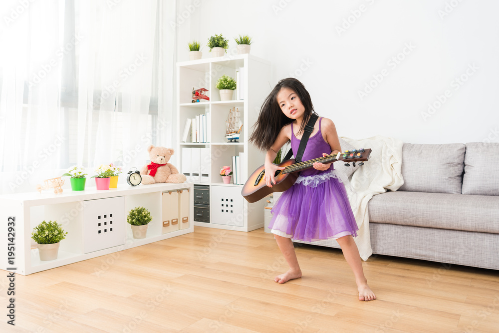 little rockstar perform in living room.