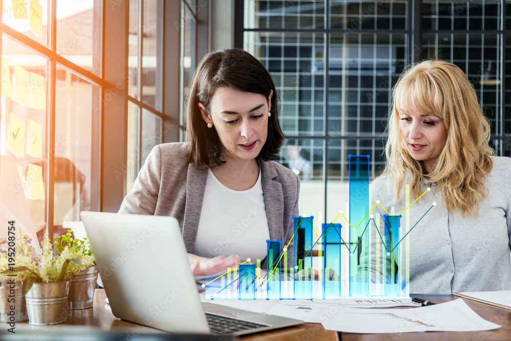 business working with woman and friend with laptop and paperwork with color tone effect