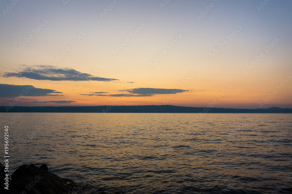 Sunset or sunrise at ocean beach landscape.