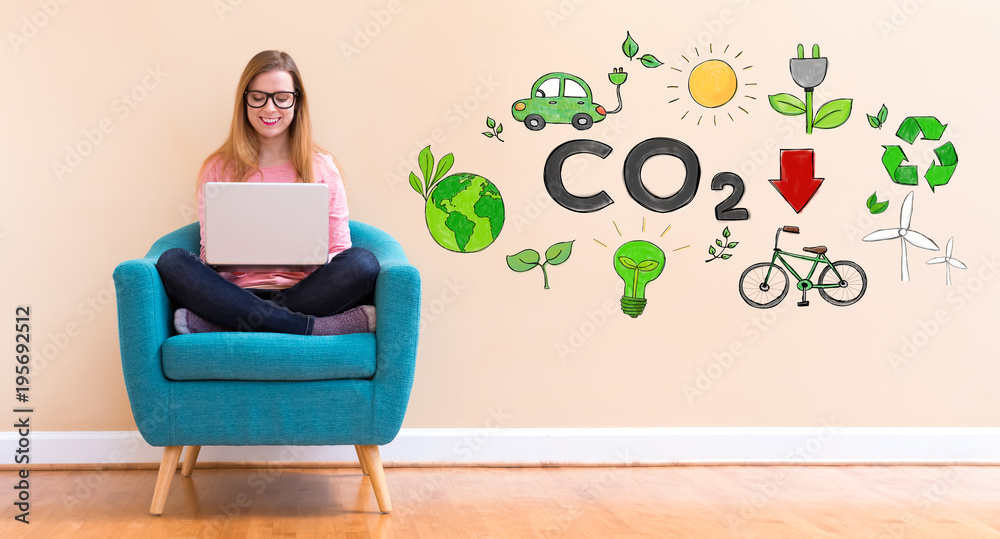 Reduce CO2 with young woman using her laptop in a chair