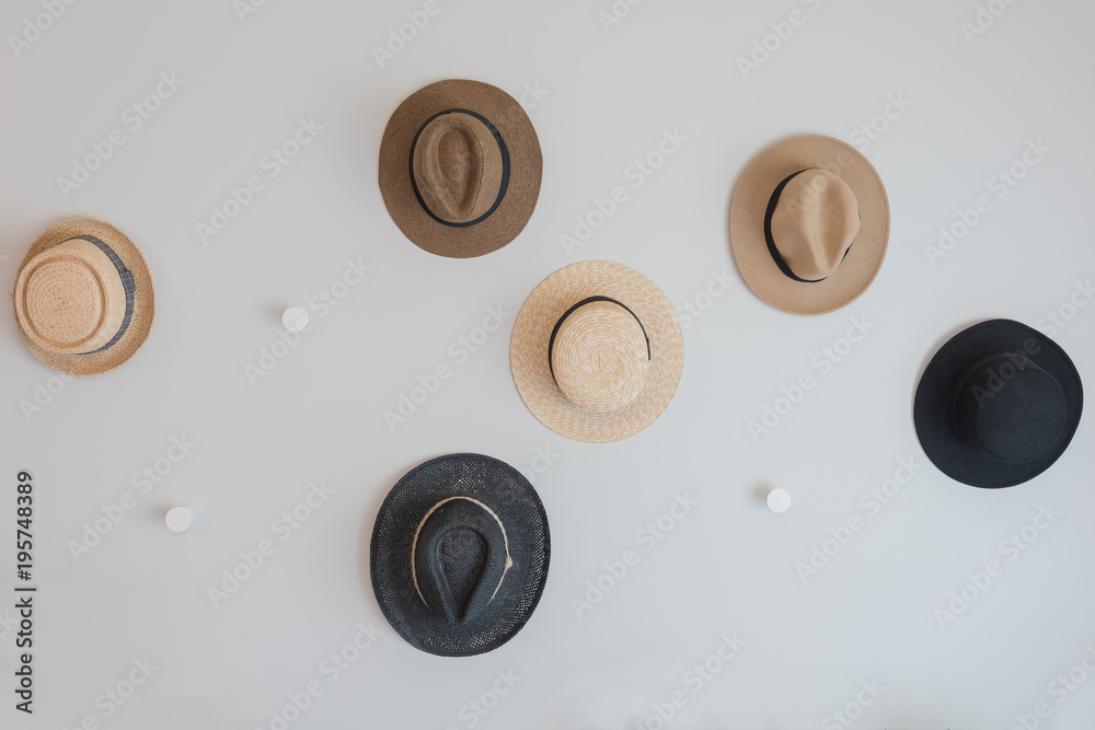 hats hanging on wall