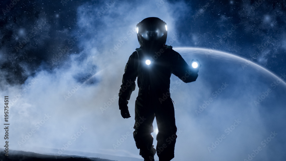 Courageous Astronaut in the Space Suit Holds Flashlight and Explores Mysterious Alien Planet Covered