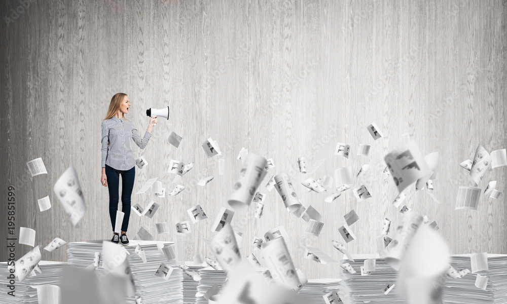 Woman keeping megaphone in hand.