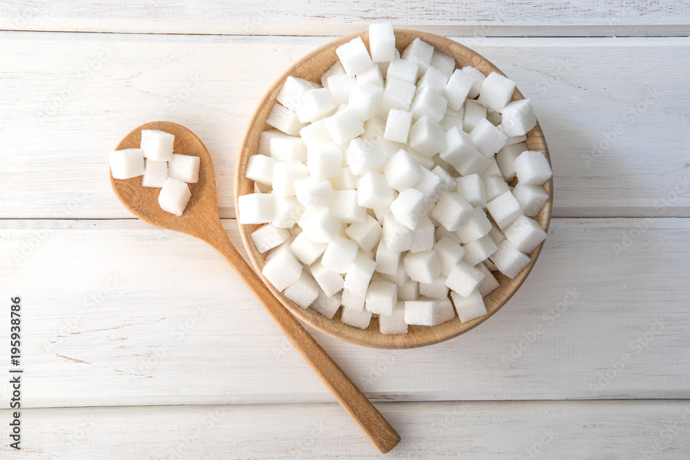 the Sugar cube in wooden bowl on white table , top view and overhead view