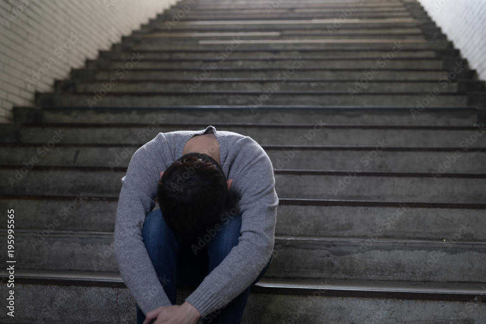 depressed man sit in underground