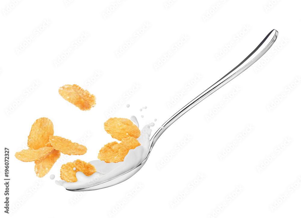 Corn flakes in a spoon with milk close-up, isolated on white background