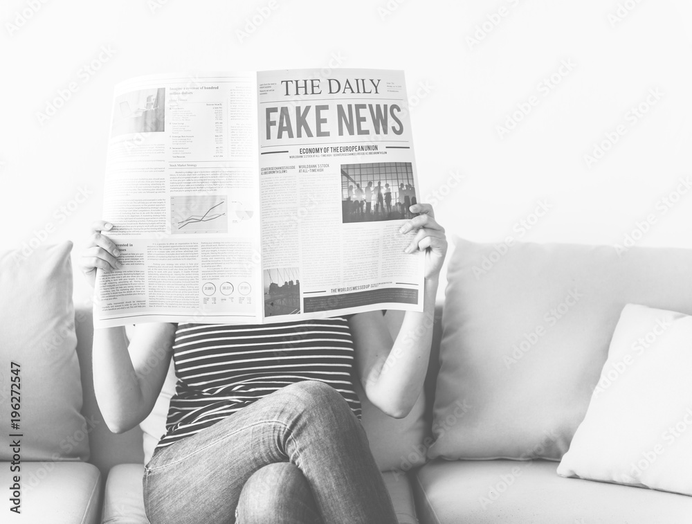 Woman reading newspaper