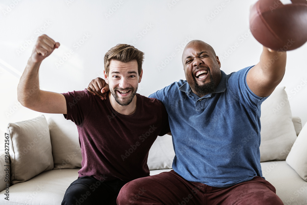 Men cheering sport together