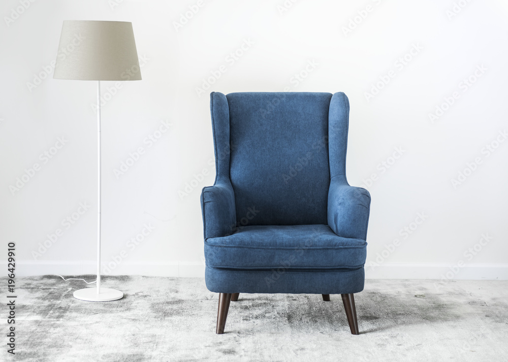 Wing back chair on a carpet no people