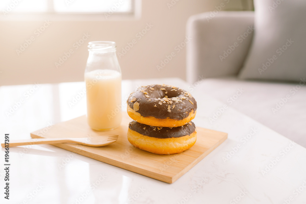 Bottle of milk and donuts, selective focus