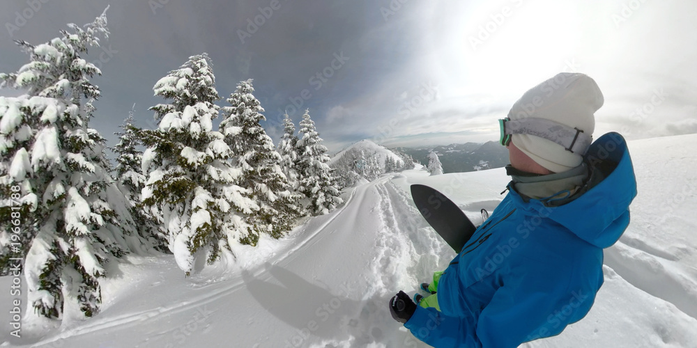 360 OVERCAPTURE 3D: Freerider looks at beautiful snow covered valley during hike