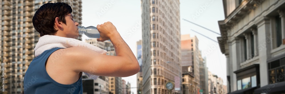 Composite image of tired young man drinking water against white