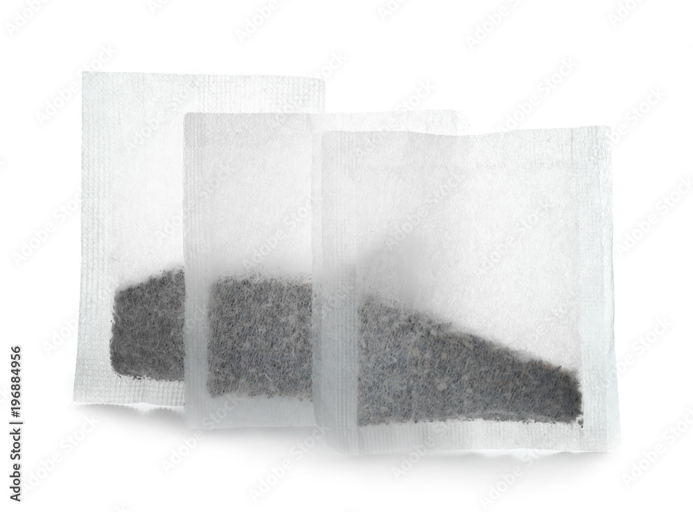 Tea bags on white background