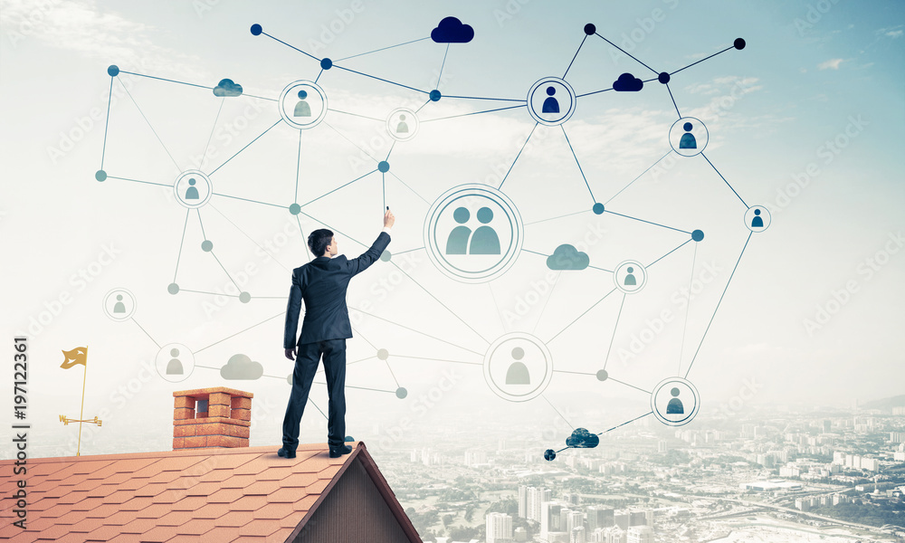 Businessman on house roof presenting networking and connection c