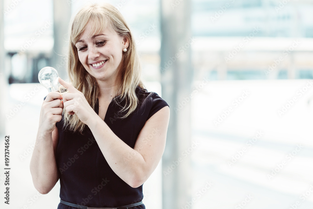 beautiful caucasian woman smile and hand hold light bulb with happiness creativity ideas concept