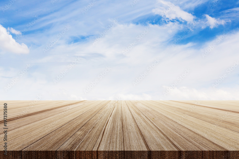 wooden plank table top with beautiful skies background