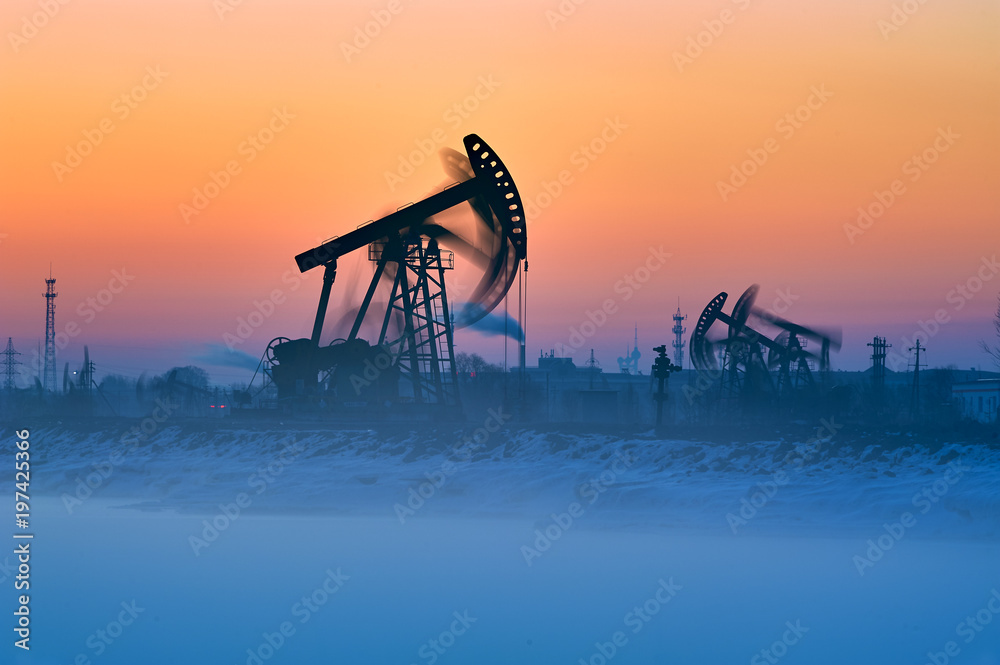 The oil fields sunrise landscape.