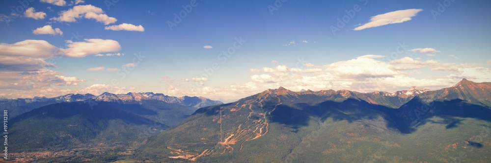 Beautiful snow covered mountains, river and forest