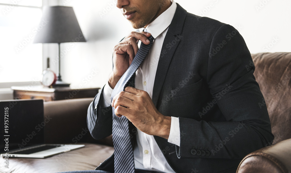 Businessman fixing his tie before a meeting